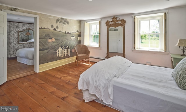 4273 Durham Rd, Kintnersville, PA 18930 - bedroom featuring crown molding, wood-type flooring, and a baseboard heating unit
