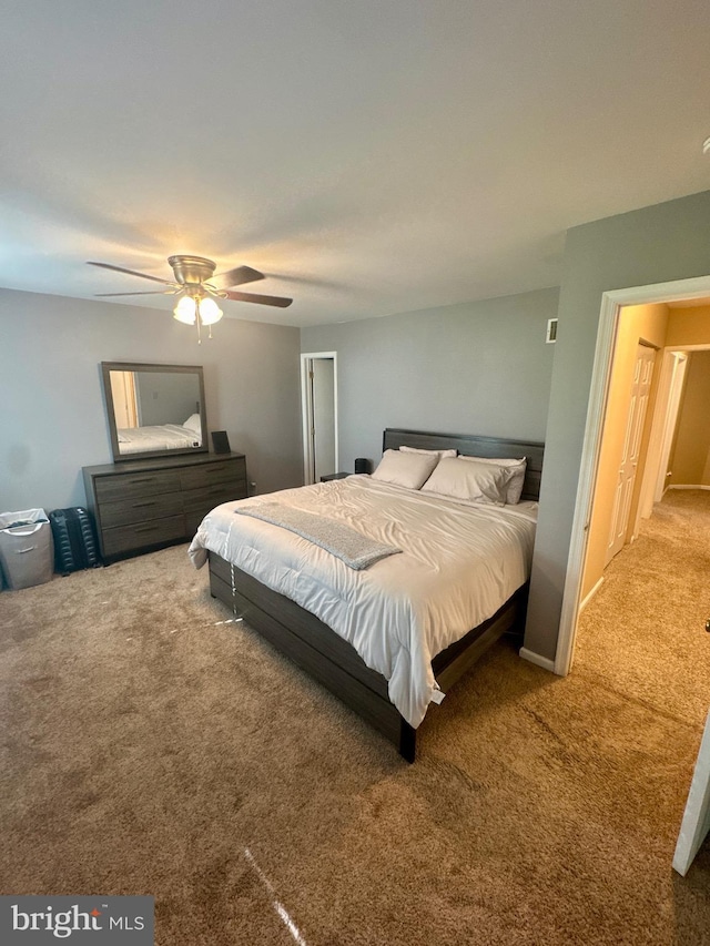 carpeted bedroom with a ceiling fan