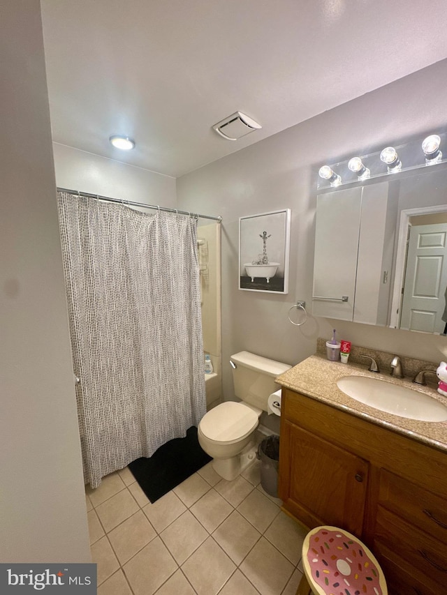 full bathroom with tile patterned floors, shower / bathtub combination with curtain, vanity, and toilet