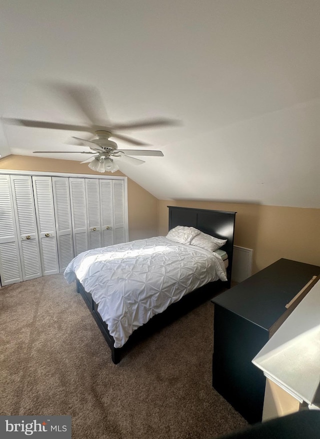 bedroom with ceiling fan, lofted ceiling, and carpet
