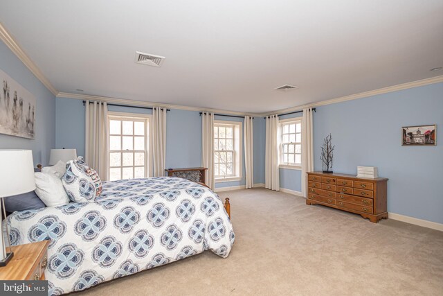 bedroom featuring baseboards, ornamental molding, carpet, and visible vents