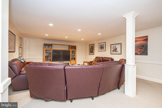 living area with ornate columns, recessed lighting, crown molding, and light carpet