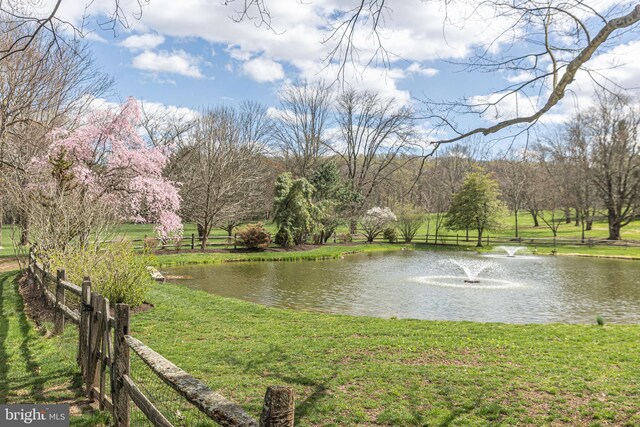 view of water feature with fence