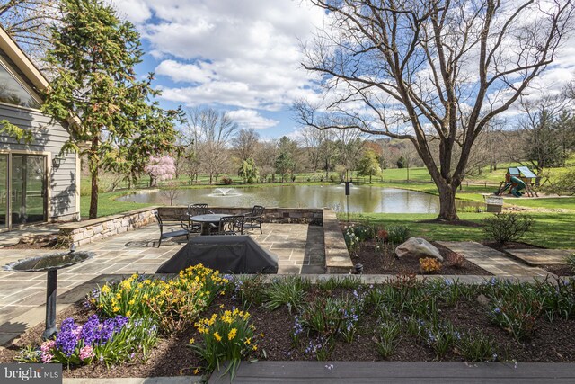 view of patio / terrace with a water view