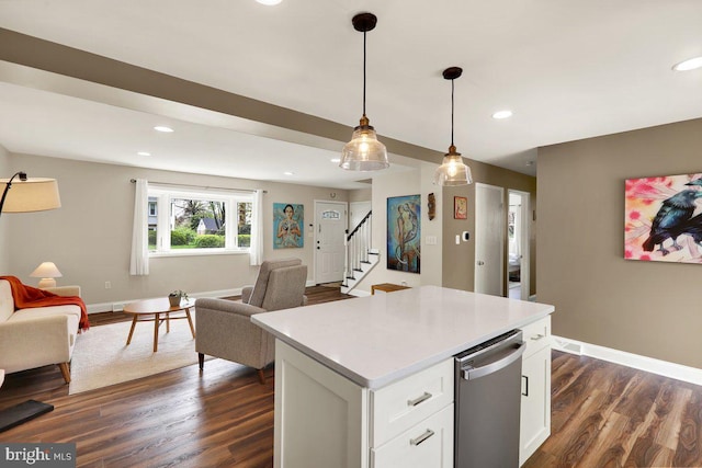 kitchen featuring recessed lighting, open floor plan, dark wood finished floors, and baseboards