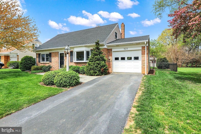 view of front of home with brick siding, an attached garage, a chimney, and aphalt driveway