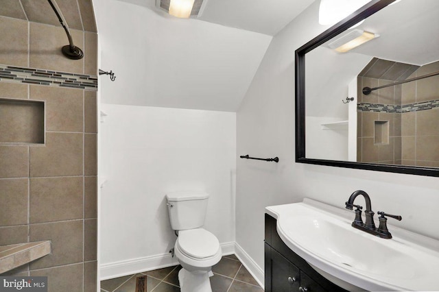 bathroom with a tile shower, toilet, tile patterned floors, baseboards, and lofted ceiling