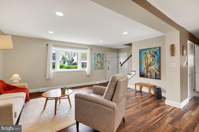 living room with baseboards, recessed lighting, dark wood finished floors, and stairs