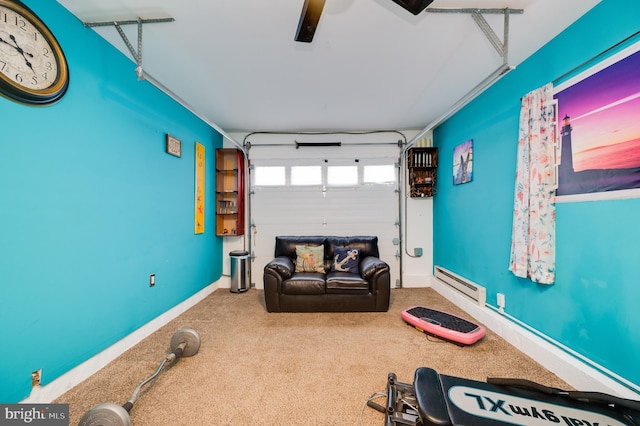 interior space with a ceiling fan, a garage, baseboards, baseboard heating, and carpet flooring