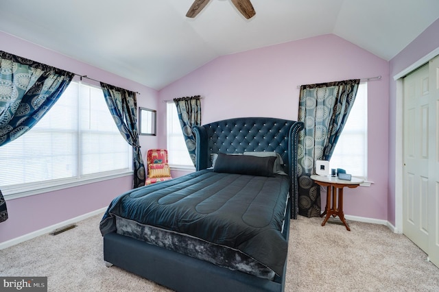 bedroom featuring baseboards, carpet, vaulted ceiling, and a closet