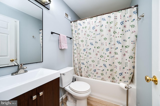 full bath with shower / bath combination with curtain, visible vents, wood finished floors, vanity, and toilet