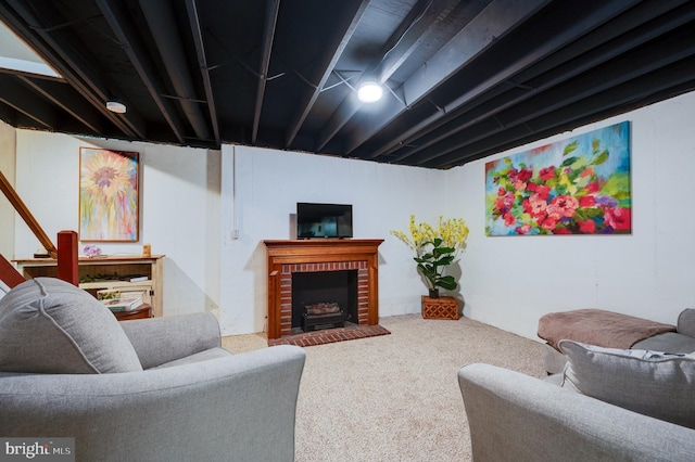 living room with carpet flooring and a fireplace