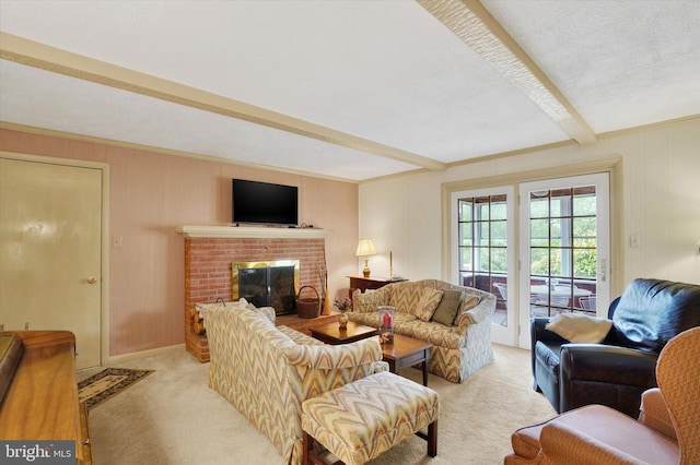 living area featuring a brick fireplace, beamed ceiling, and light colored carpet