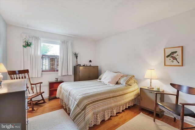 bedroom with wood finished floors
