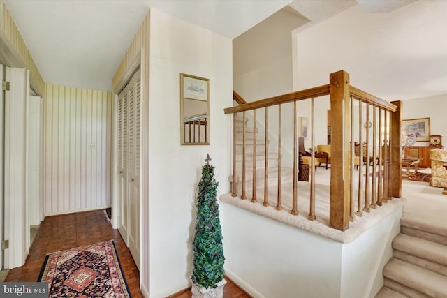 staircase featuring baseboards
