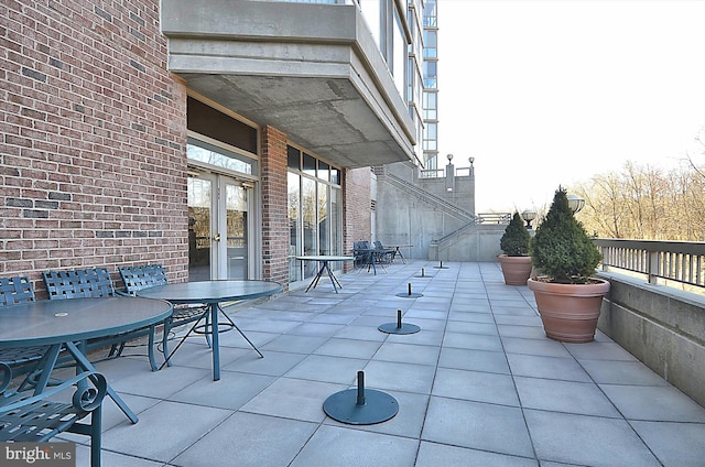 view of patio with french doors and outdoor dining space