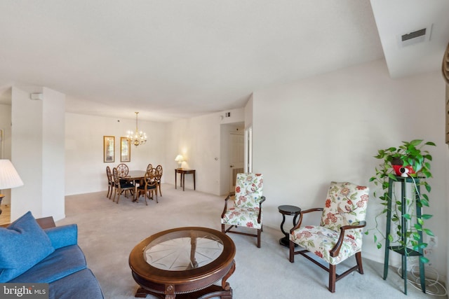 carpeted living room with a chandelier and visible vents