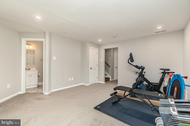 exercise area featuring visible vents, recessed lighting, baseboards, and carpet flooring