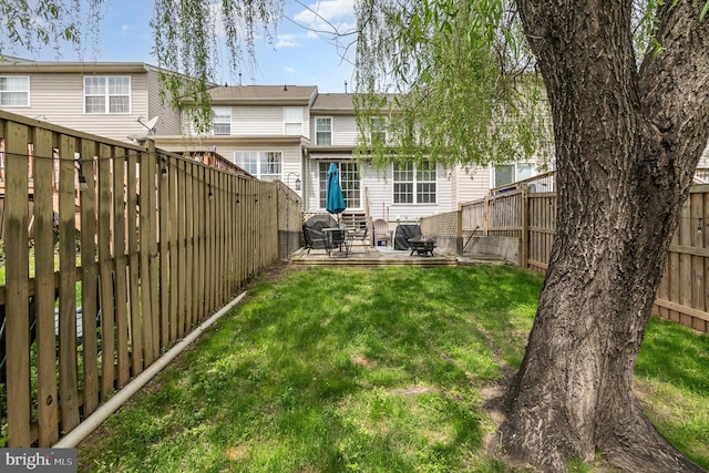 view of yard featuring a patio and a fenced backyard