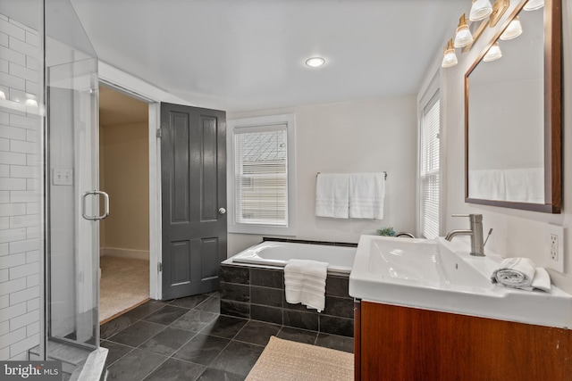 bathroom featuring a bath, tile patterned floors, a shower stall, and vanity