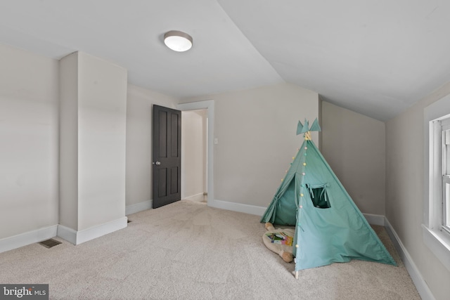 playroom with vaulted ceiling, carpet floors, and baseboards