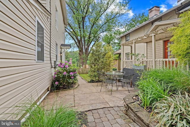view of patio / terrace with fence and outdoor dining area