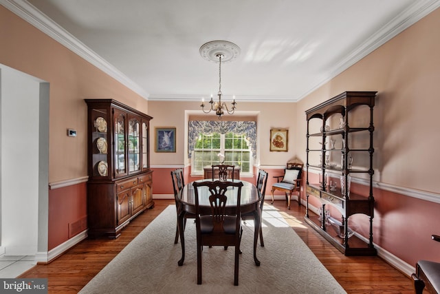 36 Crimson King Dr, Bear, DE 19701 - dining space featuring baseboards, a chandelier, ornamental molding, and wood finished floors