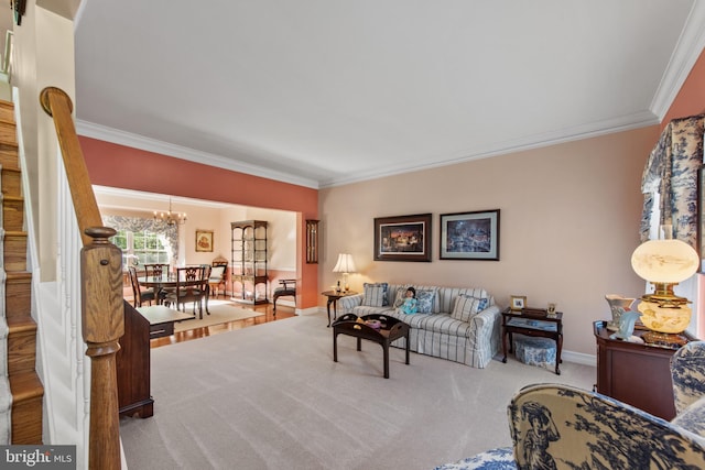 36 Crimson King Dr, Bear, DE 19701 - living room featuring carpet floors, baseboards, a chandelier, ornamental molding, and stairs