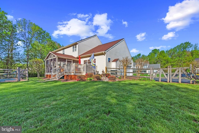 36 Crimson King Dr, Bear, DE 19701 - rear view of house featuring a lawn, a fenced backyard, and a sunroom