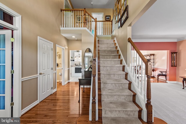 36 Crimson King Dr, Bear, DE 19701 - stairway with baseboards, a high ceiling, and wood finished floors