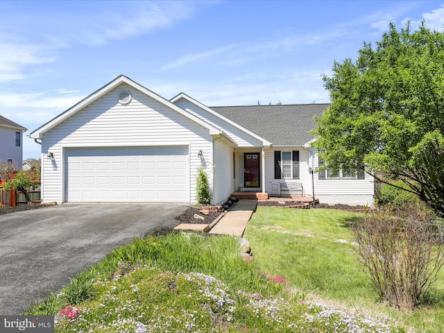 ranch-style home with a garage, a front lawn, aphalt driveway, and a shingled roof