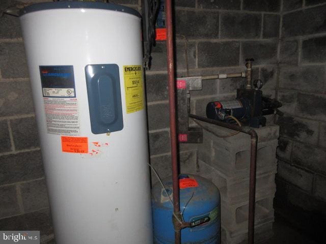 utility room with electric water heater