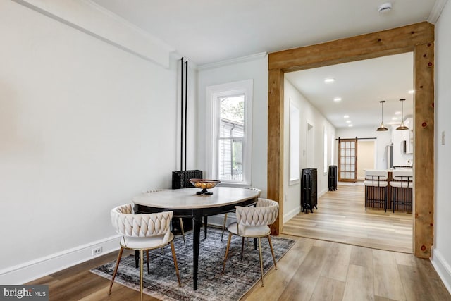 615 1st St, Lancaster, PA 17603 - dining area featuring light wood-type flooring, a barn door, and baseboards