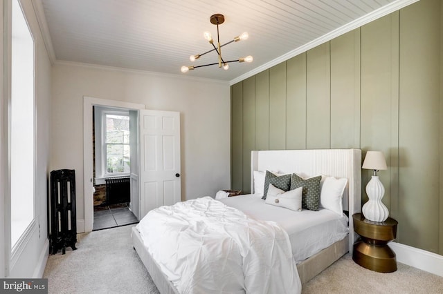 615 1st St, Lancaster, PA 17603 - bedroom featuring ornamental molding, light carpet, and a chandelier