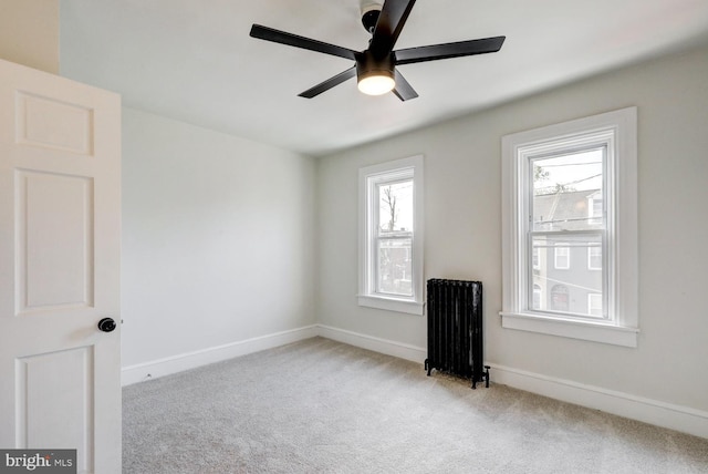 615 1st St, Lancaster, PA 17603 - empty room featuring baseboards, carpet flooring, ceiling fan, and radiator heating unit