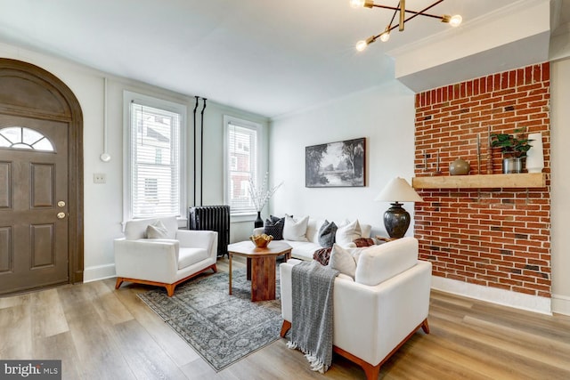 615 1st St, Lancaster, PA 17603 - living room featuring an inviting chandelier, baseboards, and wood finished floors