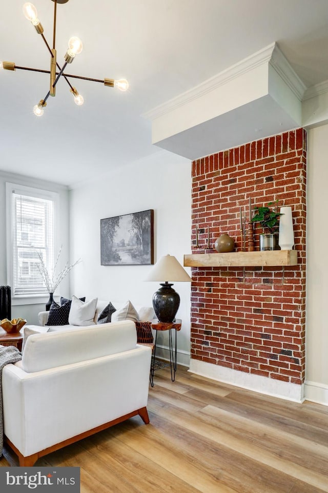 615 1st St, Lancaster, PA 17603 - living room with baseboards, ornamental molding, wood finished floors, and a notable chandelier