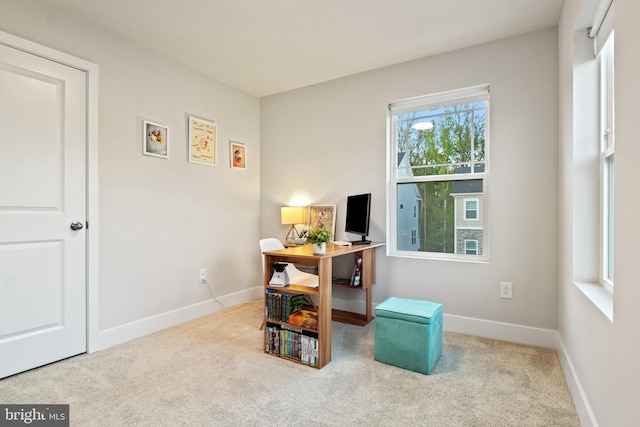 office with baseboards and carpet