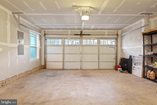garage with a garage door opener and electric panel