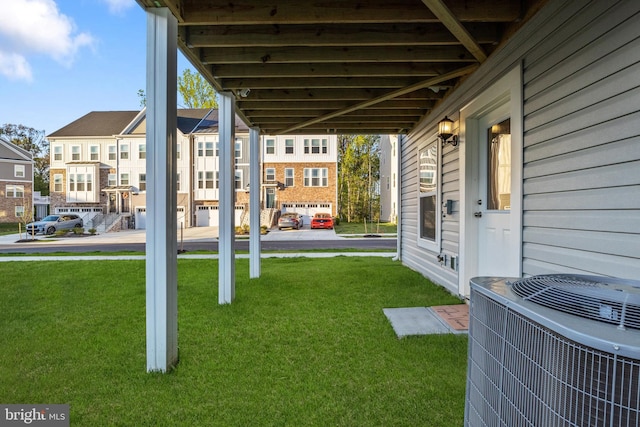 view of yard featuring a residential view and cooling unit