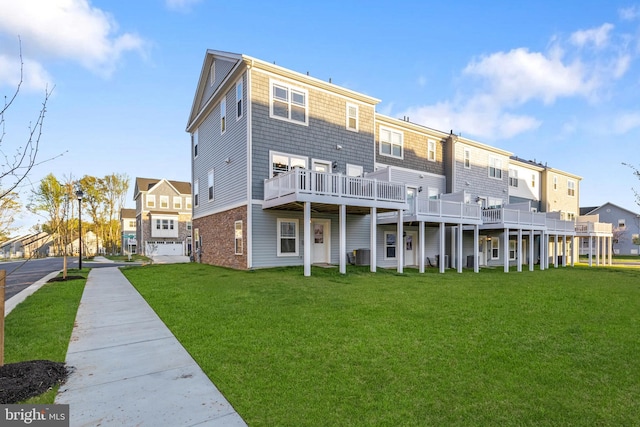 back of house with central AC unit, a yard, and a residential view