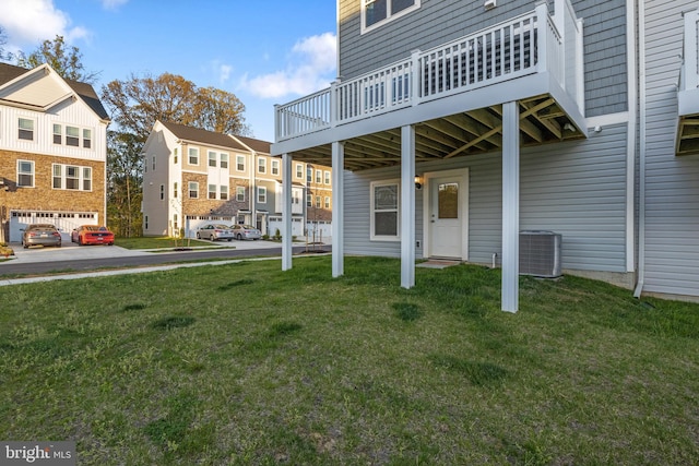 view of yard with a deck and cooling unit