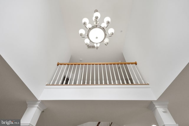 details with a notable chandelier and visible vents