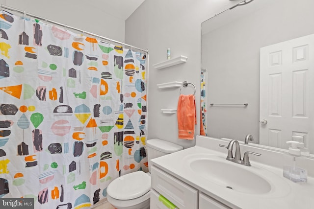 full bathroom with vanity, curtained shower, and toilet