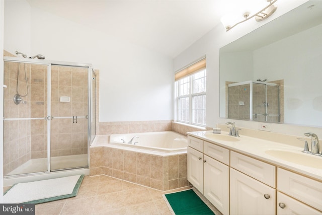 bathroom featuring a sink, tile patterned floors, a stall shower, and a bath