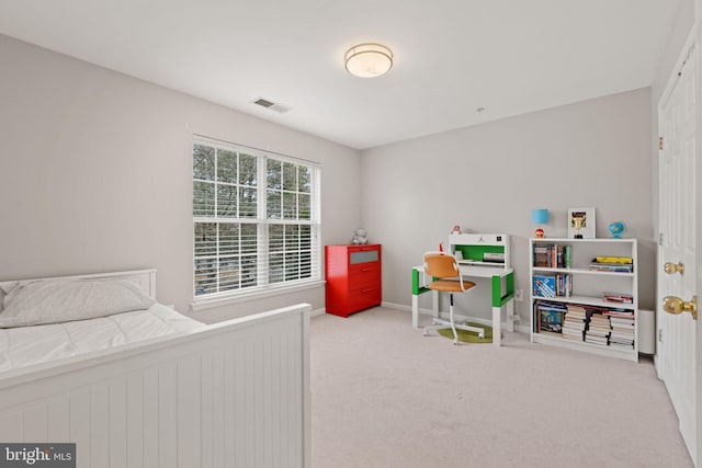 carpeted bedroom with baseboards and visible vents