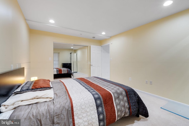 bedroom with carpet flooring, recessed lighting, baseboards, and a closet