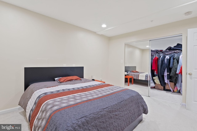 carpeted bedroom featuring baseboards, a closet, and recessed lighting