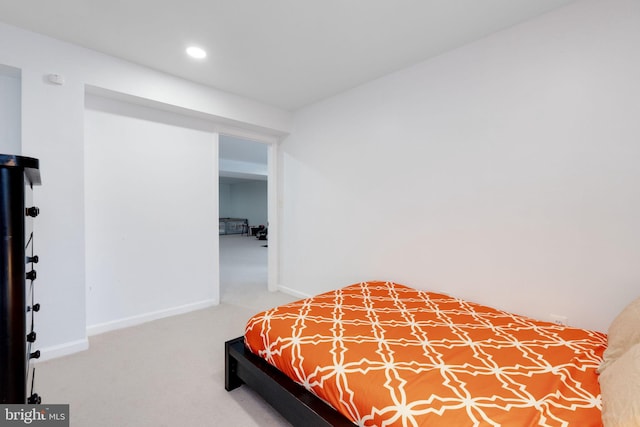carpeted bedroom featuring recessed lighting and baseboards
