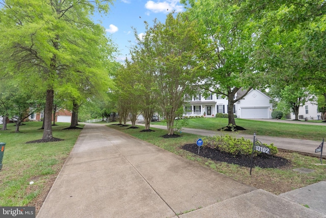 view of property's community with a yard